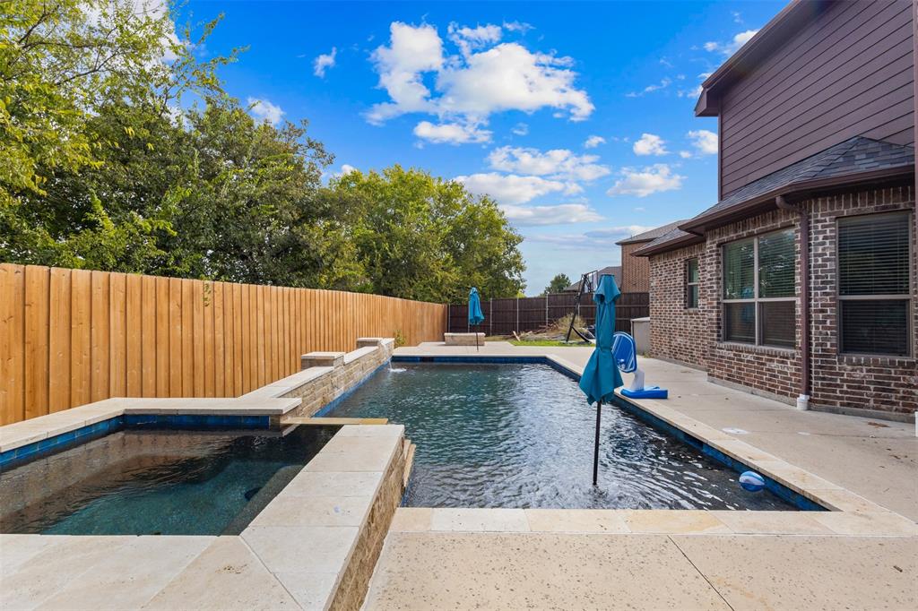 800 Goose Court Forney, TX 75126 - Photo 3 of 34 a view of a backyard with sitting area