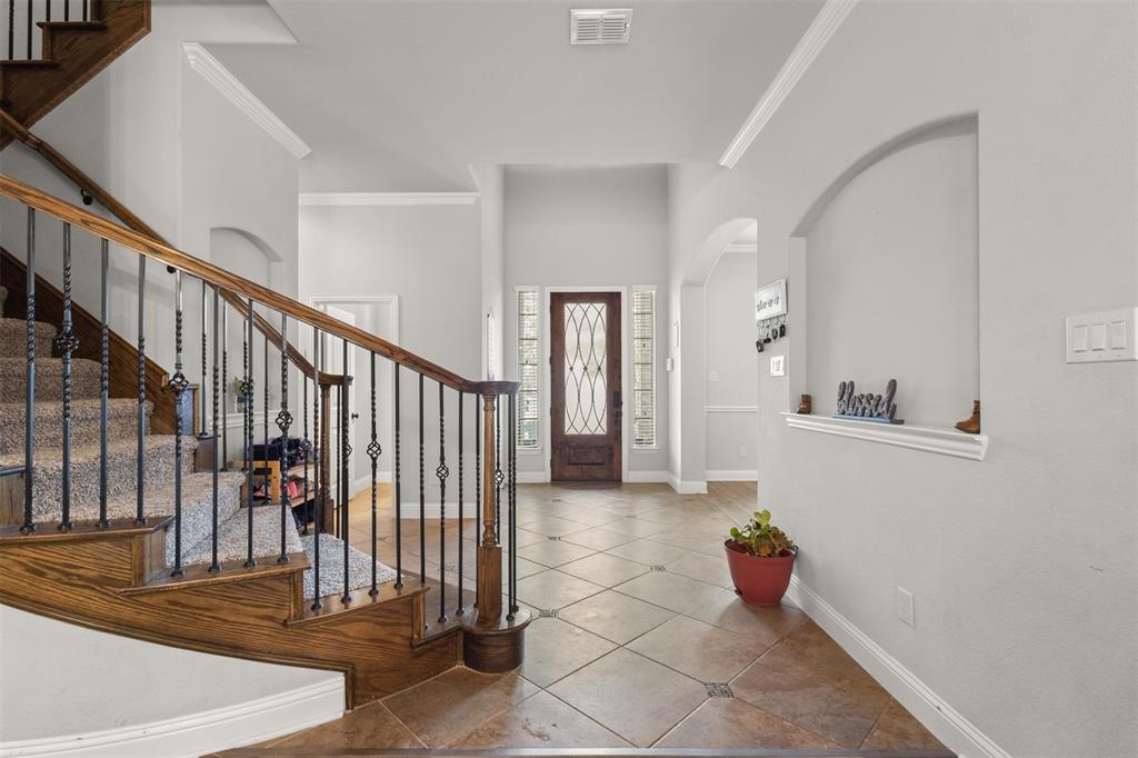 800 Goose Court Forney, TX 75126 - Photo 6 of 34 a view of entryway and hall with a sink