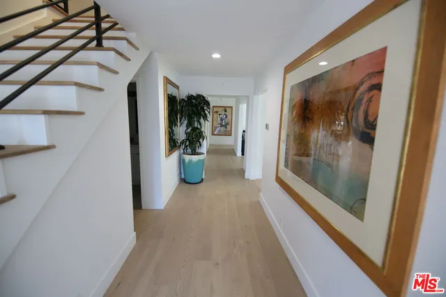 a view of hallway with glass door and glass door