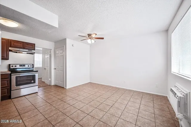a view of a kitchen with microwave and stove