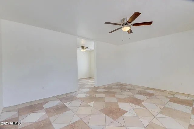 a view of a ceiling fan and wooden floor