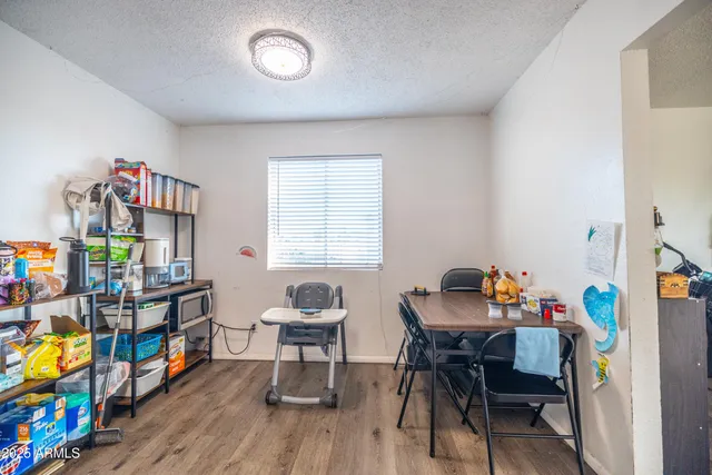 a reading room with furniture and a window