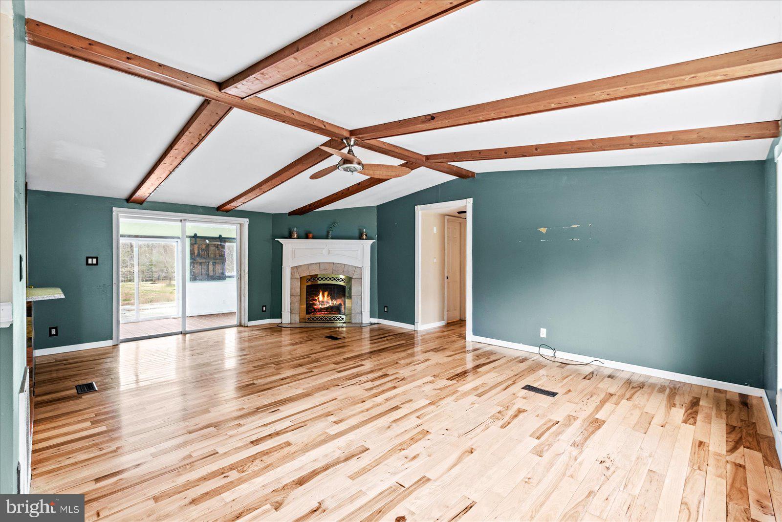 312 Timber Trail Spotsylvania, VA 22551 - Photo 25 of 74 a view of empty room with wooden floor and fireplace