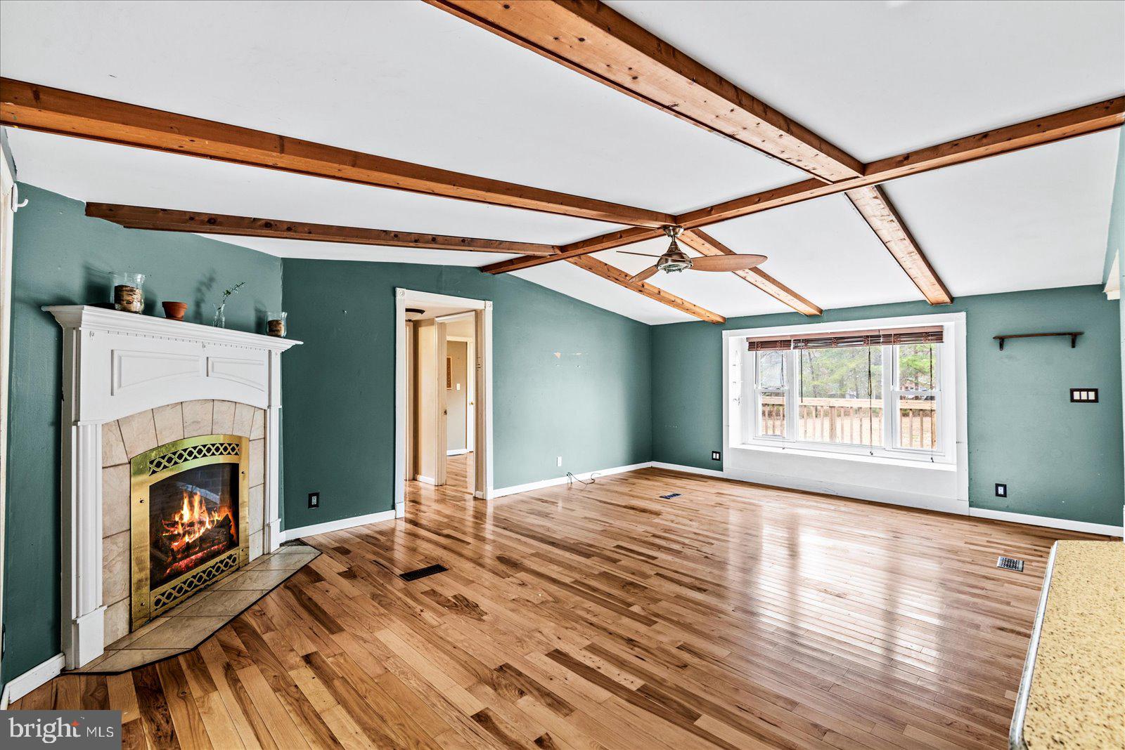 312 Timber Trail Spotsylvania, VA 22551 - Photo 29 of 74 a view of empty room with wooden floor and fireplace