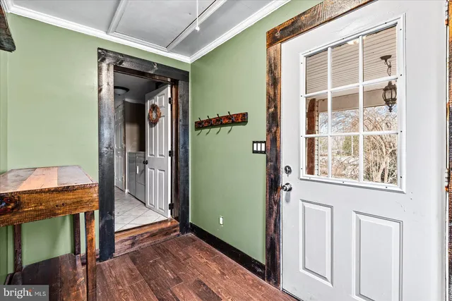a view of wooden floor and windows in a room