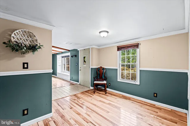 a front view of a house with yard and seating