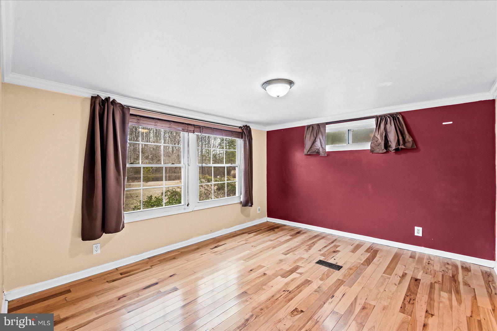 312 Timber Trail Spotsylvania, VA 22551 - Photo 41 of 74 a view of an empty room with a window and wooden floor