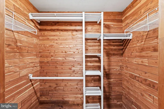 a aerial view of a house with a yard and lake view