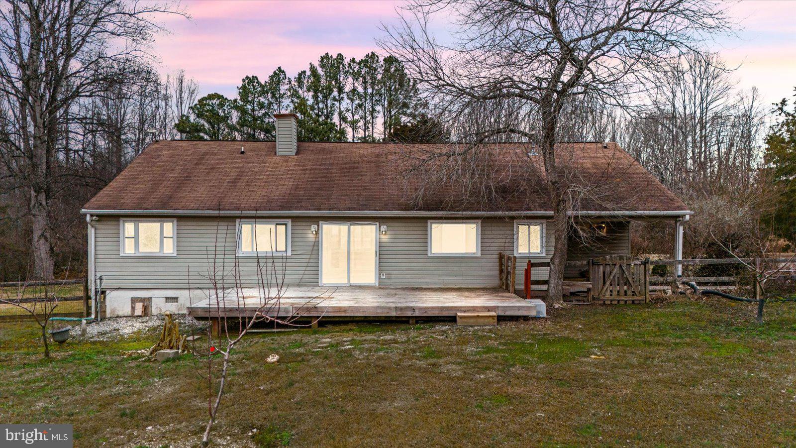 312 Timber Trail Spotsylvania, VA 22551 - Photo 10 of 74 a front view of house with yard and trees in the background