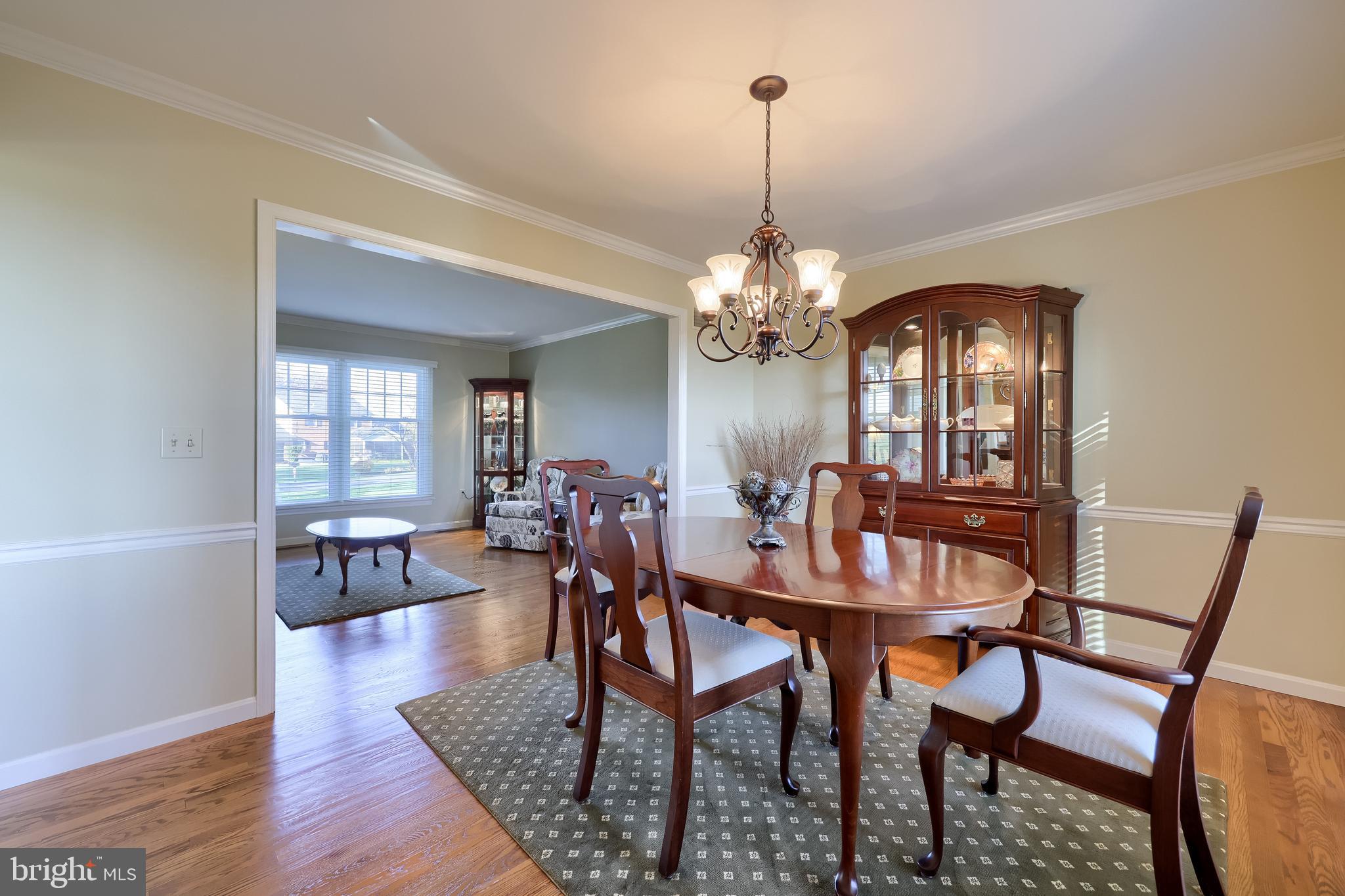 2 Mill Ridge Court Lancaster, PA 17601 - Photo 16 of 79 a view of a dining room with furniture a chandelier and wooden floor