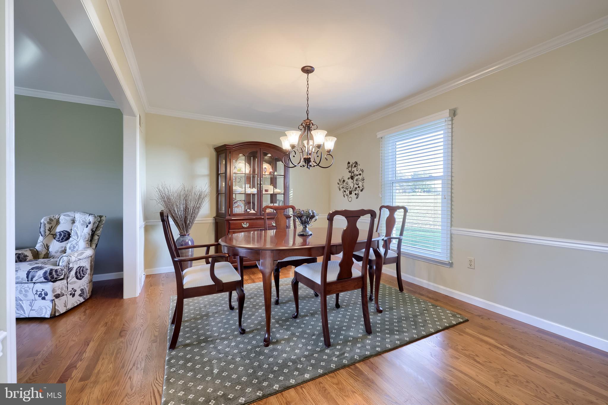 2 Mill Ridge Court Lancaster, PA 17601 - Photo 17 of 79 a dining room with furniture wooden floor a rug and a chandelier