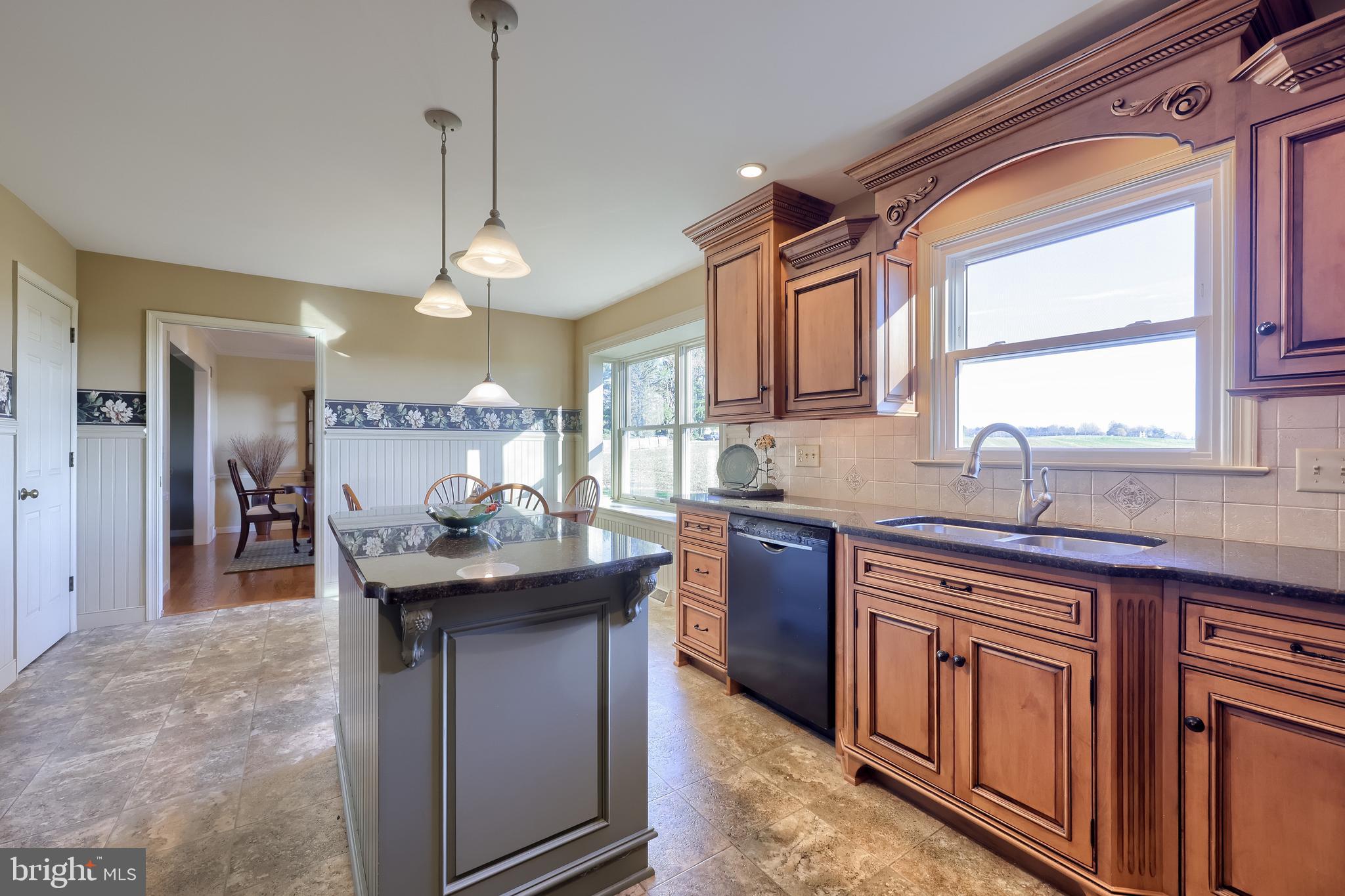 2 Mill Ridge Court Lancaster, PA 17601 - Photo 21 of 79 a kitchen with kitchen island granite countertop a sink stove and refrigerator