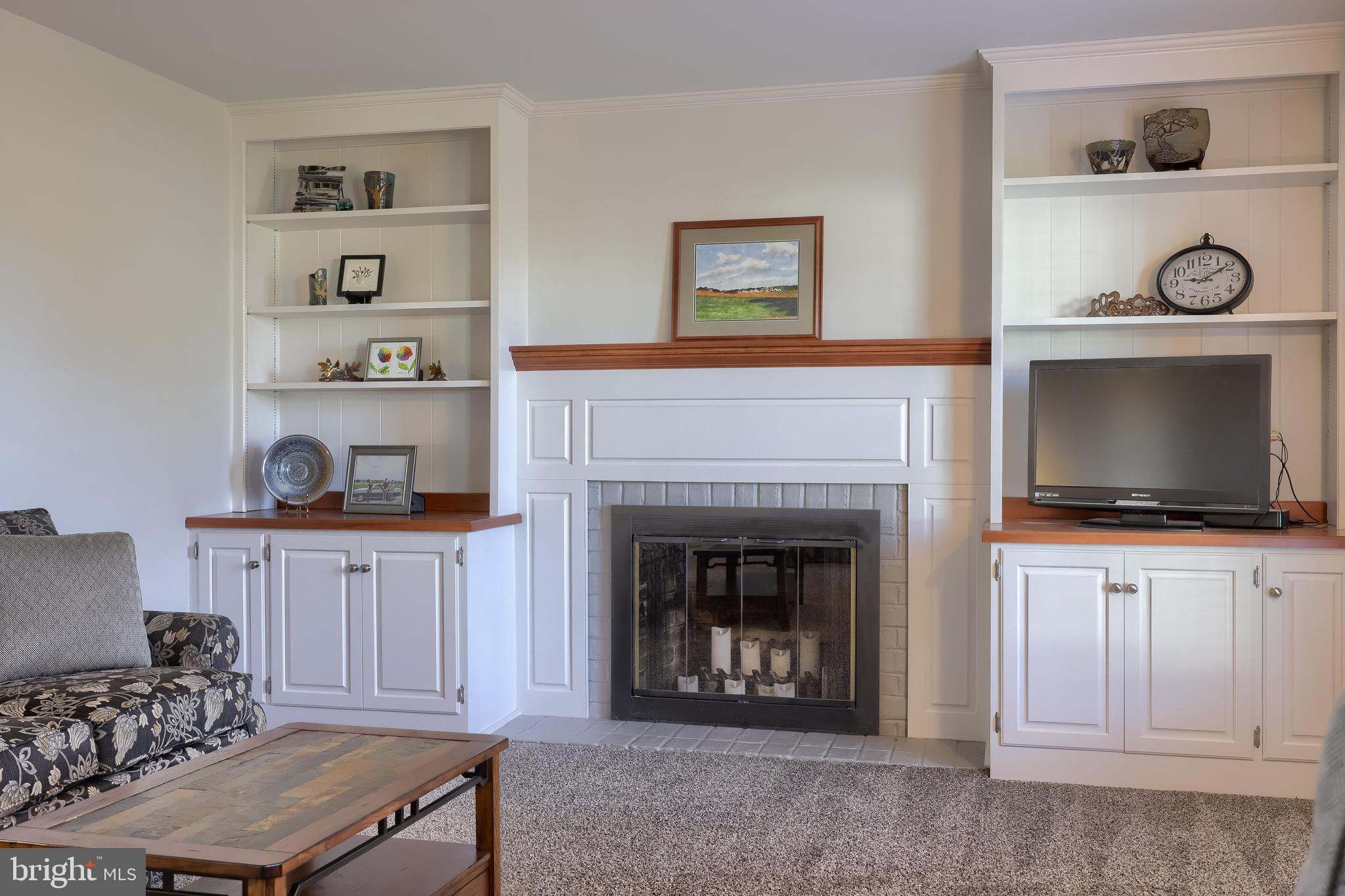 2 Mill Ridge Court Lancaster, PA 17601 - Photo 31 of 79 a living room with furniture a flat screen tv and a fireplace