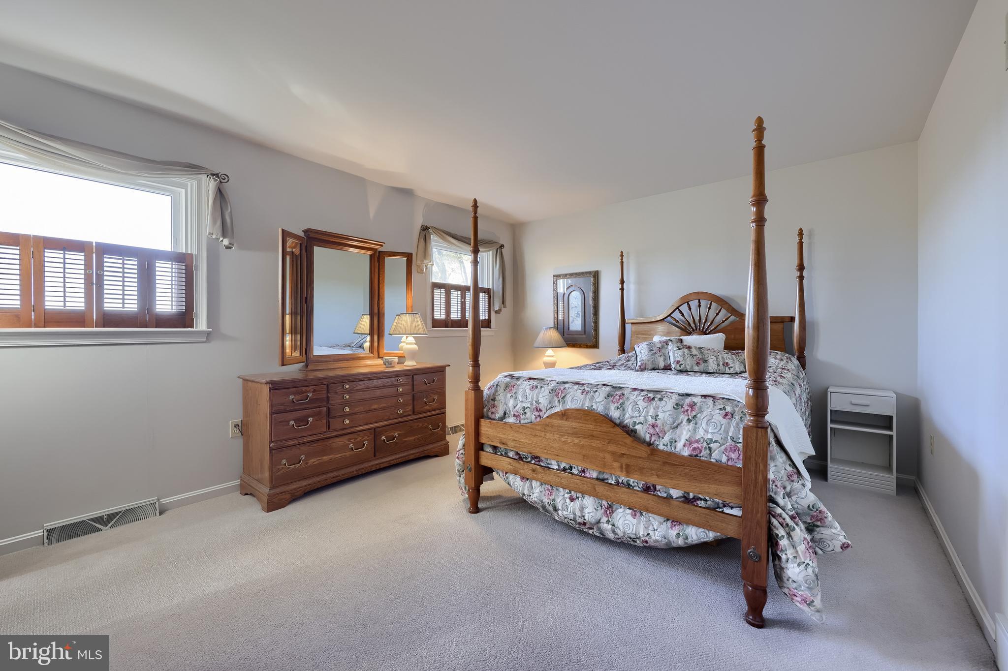 2 Mill Ridge Court Lancaster, PA 17601 - Photo 41 of 79 a bedroom with a bed and large windows