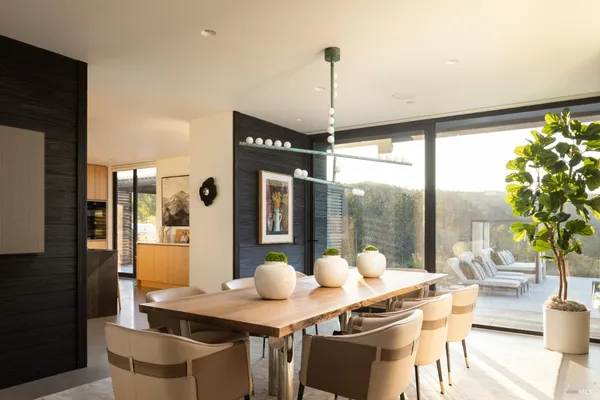 a view of a dining room with furniture window and outside view