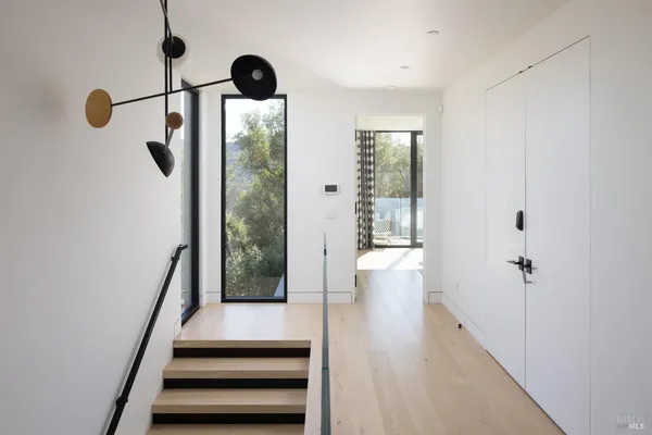 a view of staircase with white walls