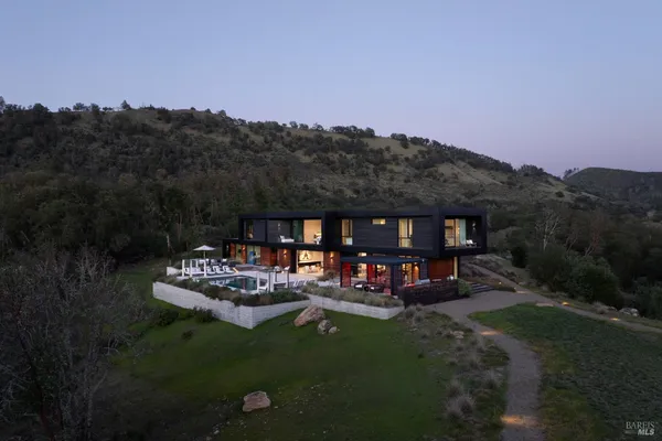 a view of a chairs and table in a patio