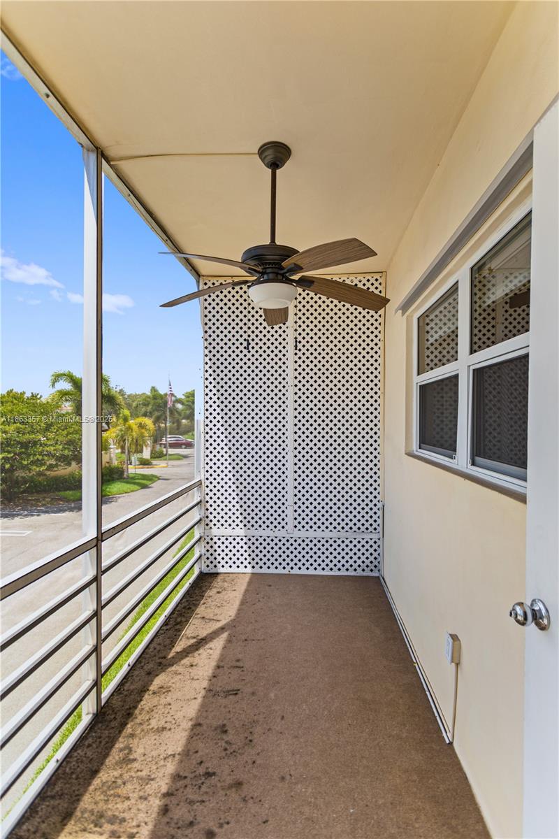 4299 Northwest 16th Street, Unit 210 Lauderhill, FL 33313 - Photo 11 of 37 a view of a balcony with a floor to ceiling window