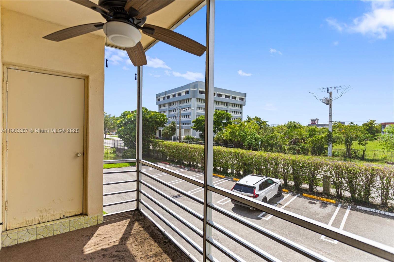 4299 Northwest 16th Street, Unit 210 Lauderhill, FL 33313 - Photo 12 of 37 a view of a balcony with couches and wooden floor