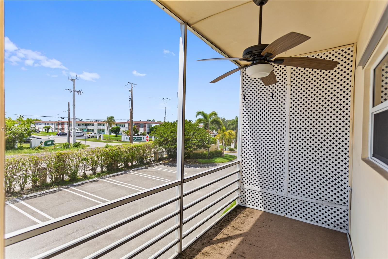 4299 Northwest 16th Street, Unit 210 Lauderhill, FL 33313 - Photo 13 of 37 a view of a balcony with floor to ceiling windows with wooden floor