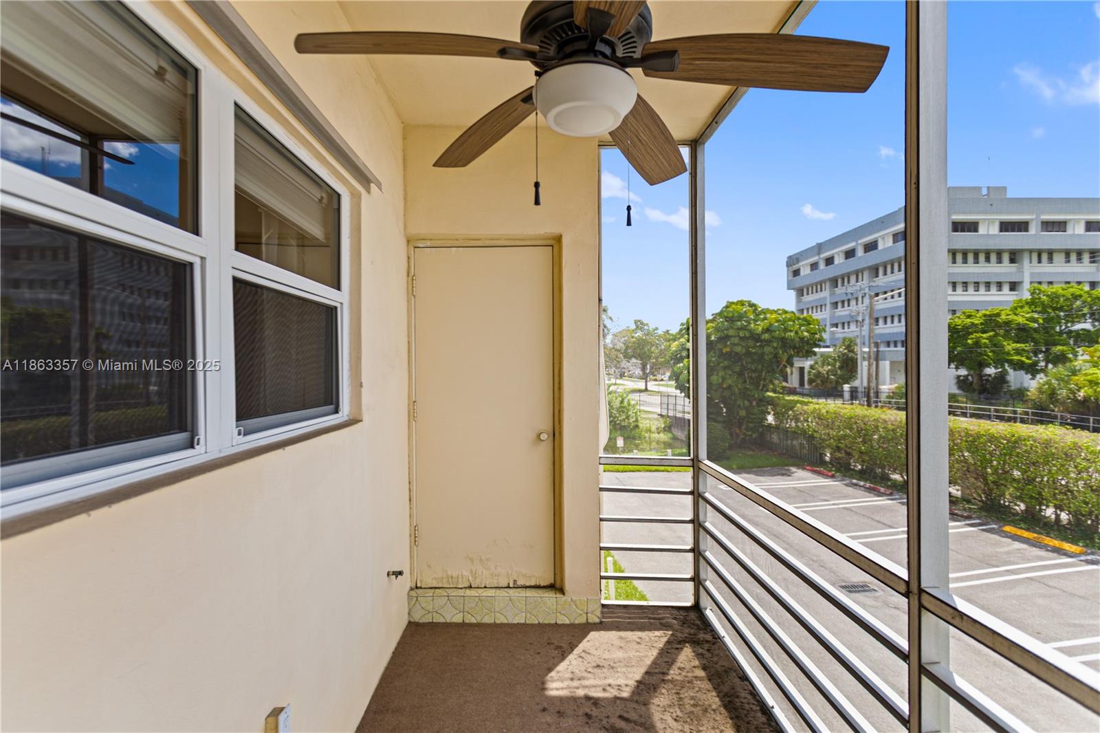 4299 Northwest 16th Street, Unit 210 Lauderhill, FL 33313 - Photo 14 of 37 a view of a balcony with a potted plant