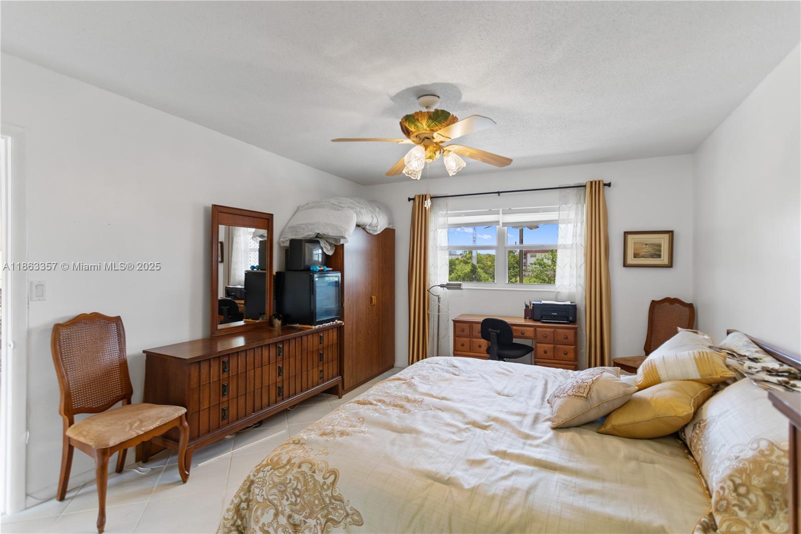 4299 Northwest 16th Street, Unit 210 Lauderhill, FL 33313 - Photo 16 of 37 a bedroom with a bed and furniture