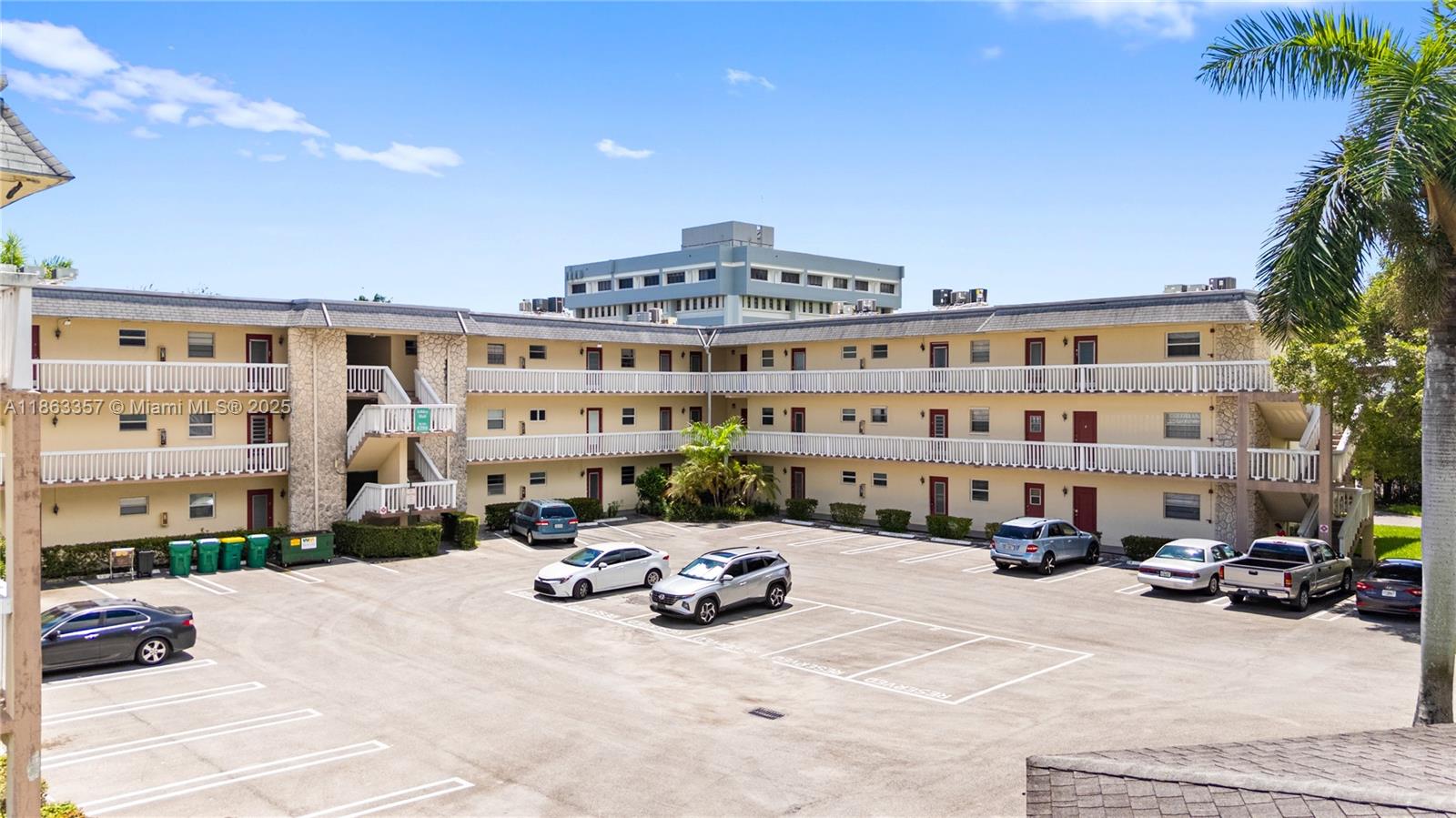 4299 Northwest 16th Street, Unit 210 Lauderhill, FL 33313 - Photo 33 of 37 a view of a building with cars parked