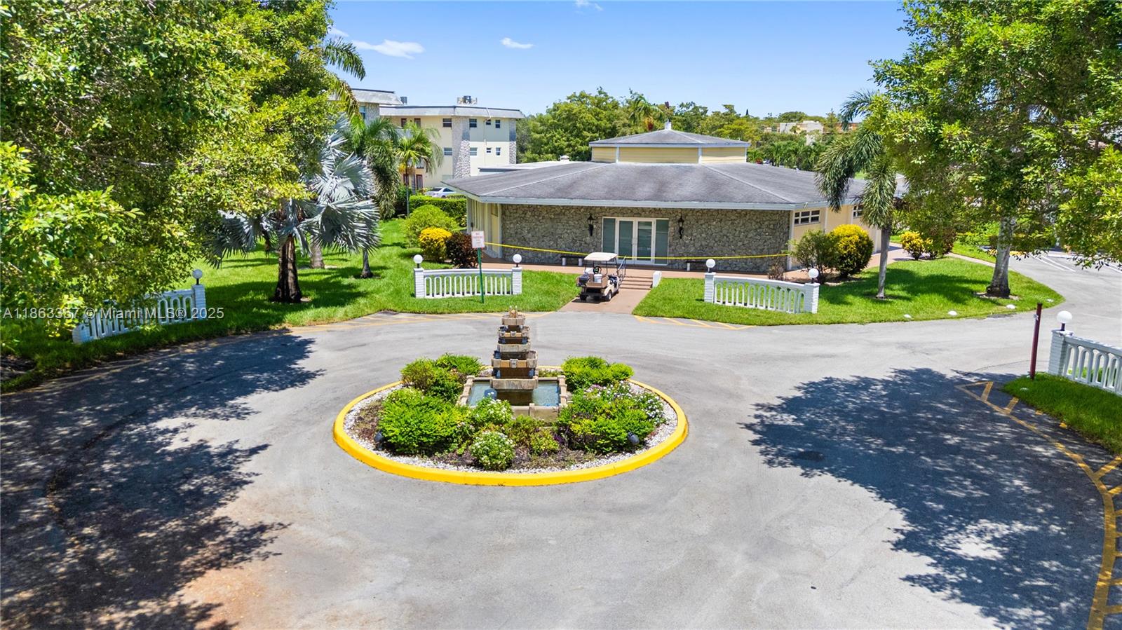 4299 Northwest 16th Street, Unit 210 Lauderhill, FL 33313 - Photo 34 of 37 a view of a swimming pool with a yard and plants