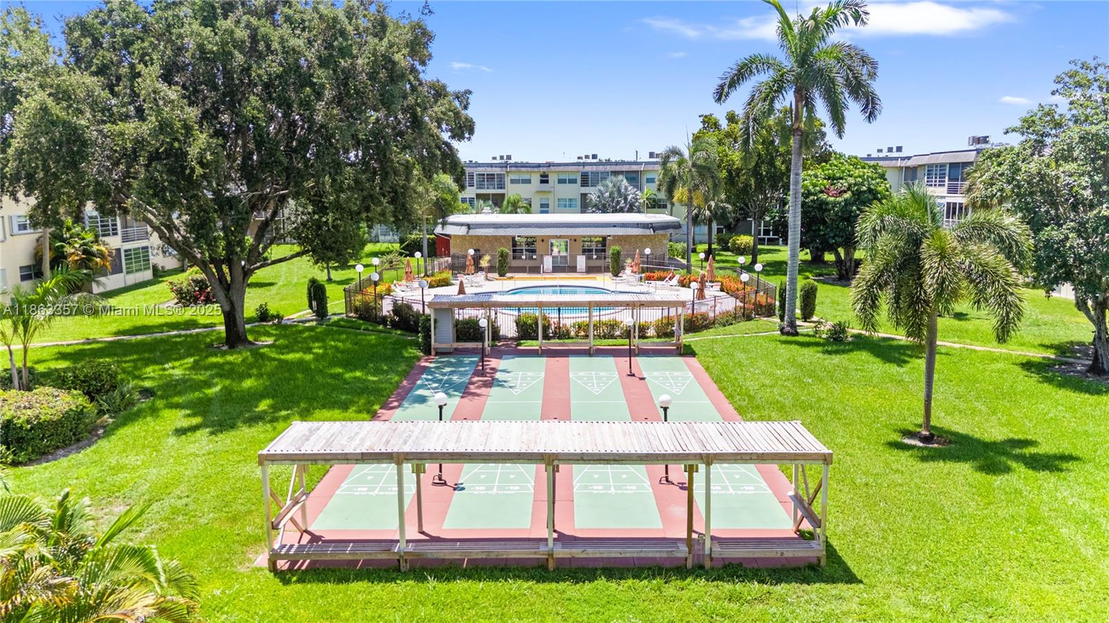 4299 Northwest 16th Street, Unit 210 Lauderhill, FL 33313 - Photo 36 of 37 a view of house with swimming pool outdoor seating area