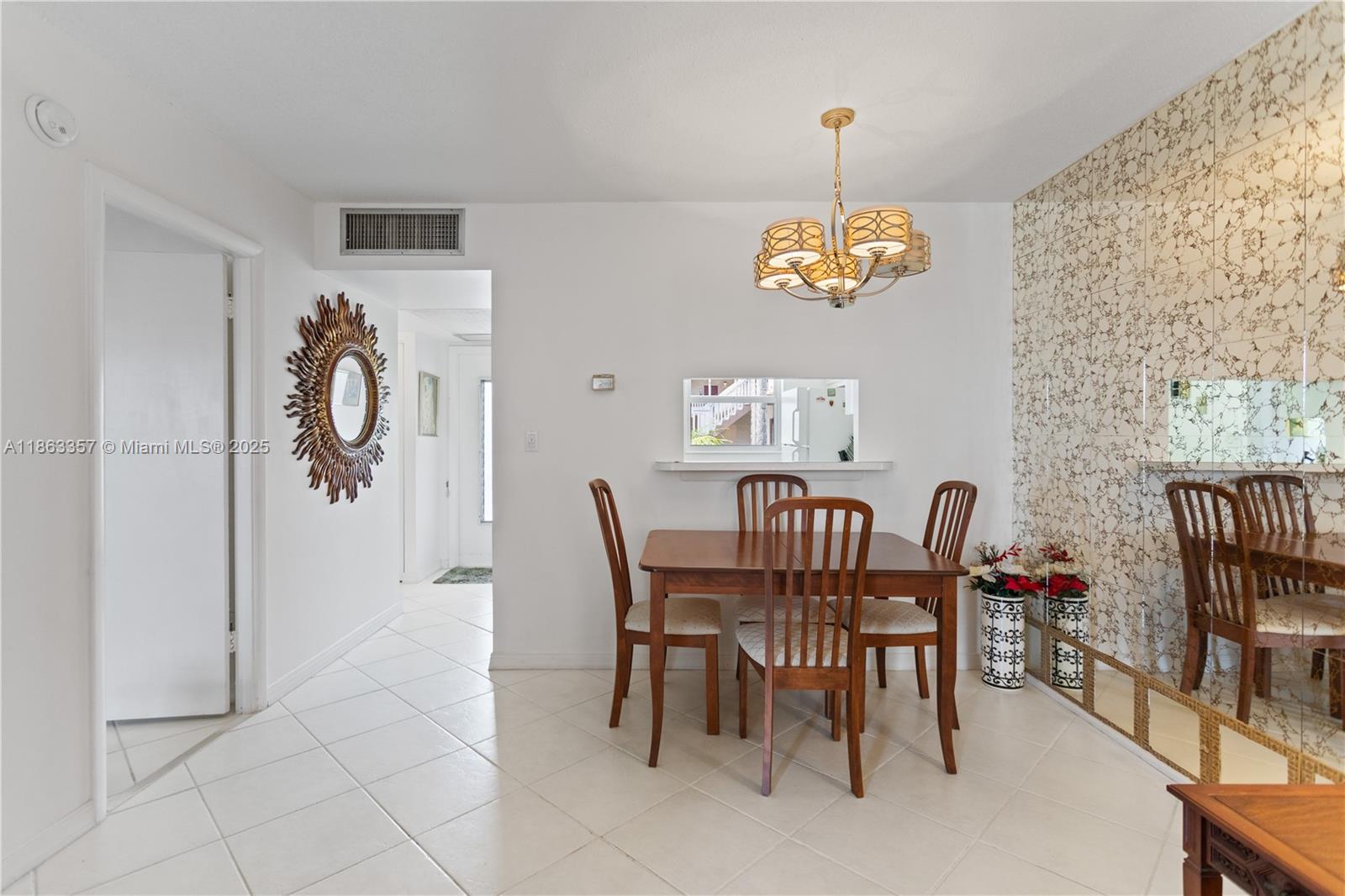 4299 Northwest 16th Street, Unit 210 Lauderhill, FL 33313 - Photo 5 of 37 a dining room with furniture and window