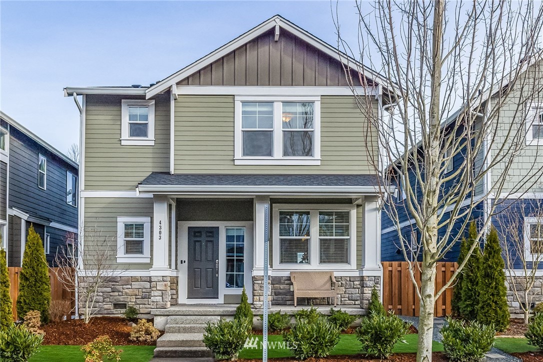 4303 Riverfront Boulevard Everett, WA 98203 - Photo 1 of 40 a view of a brick house with many windows