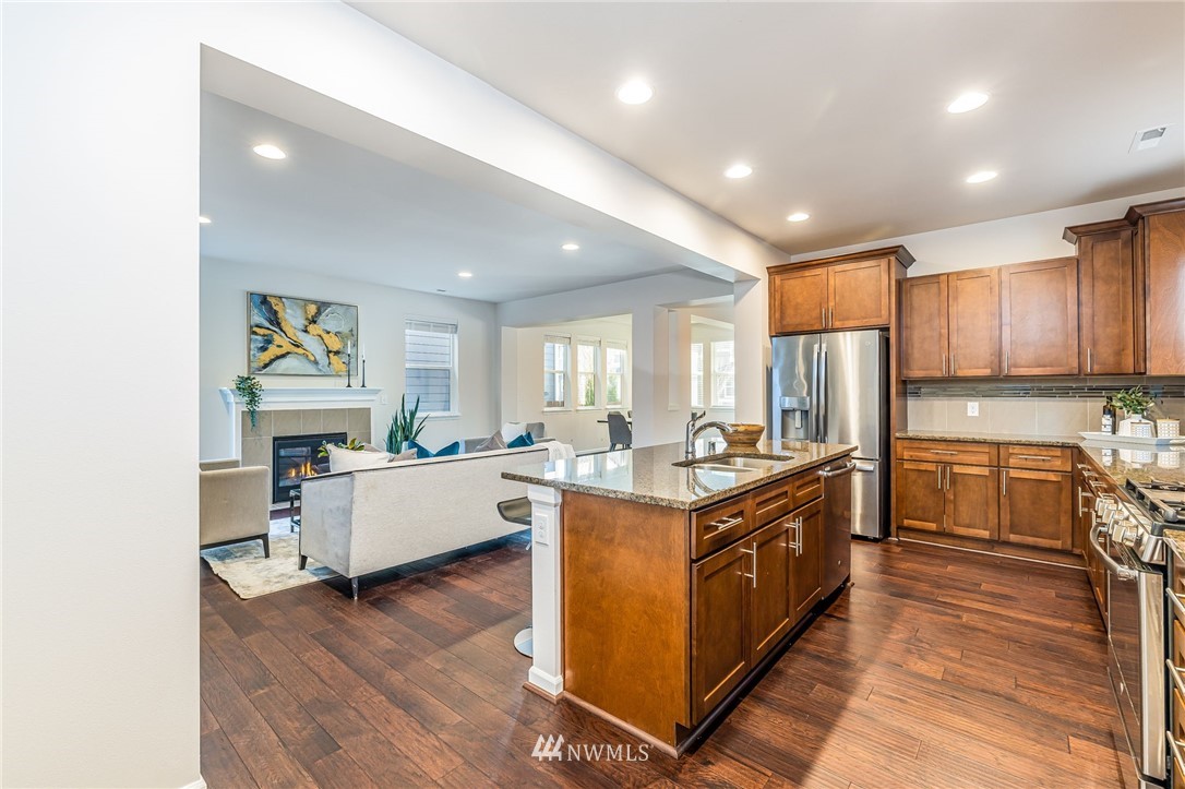 4303 Riverfront Boulevard Everett, WA 98203 - Photo 14 of 40 a large kitchen with stainless steel appliances granite countertop a stove and a refrigerator