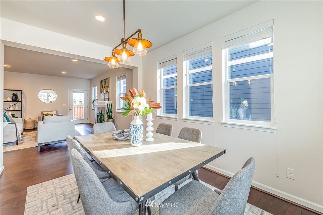 4303 Riverfront Boulevard Everett, WA 98203 - Photo 16 of 40 a dining room with furniture and wooden floor