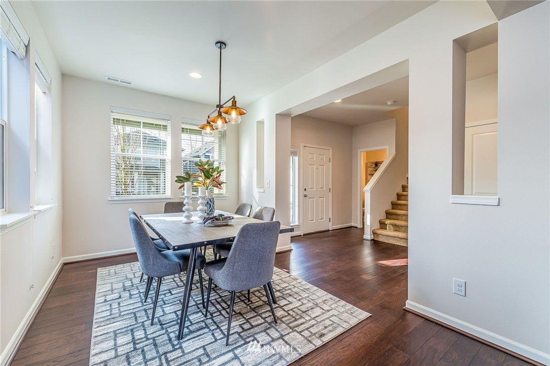 4303 Riverfront Boulevard Everett, WA 98203 - Photo 19 of 40 a view of a dining room with furniture and wooden floor