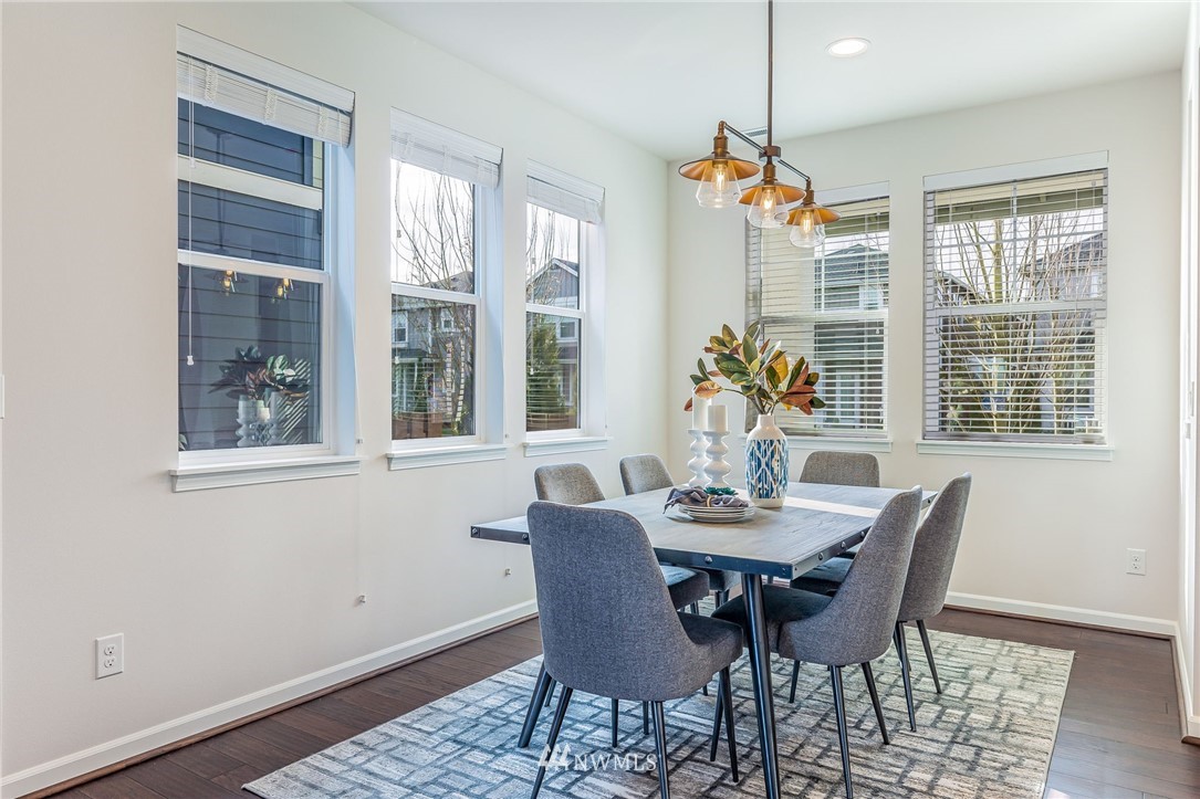 4303 Riverfront Boulevard Everett, WA 98203 - Photo 20 of 40 a dining room with furniture wooden floor and a chandelier