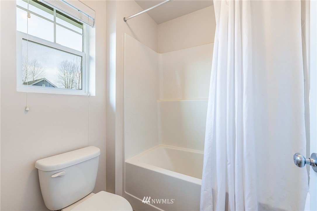 4303 Riverfront Boulevard Everett, WA 98203 - Photo 22 of 40 a white toilet sitting next to a bath tub