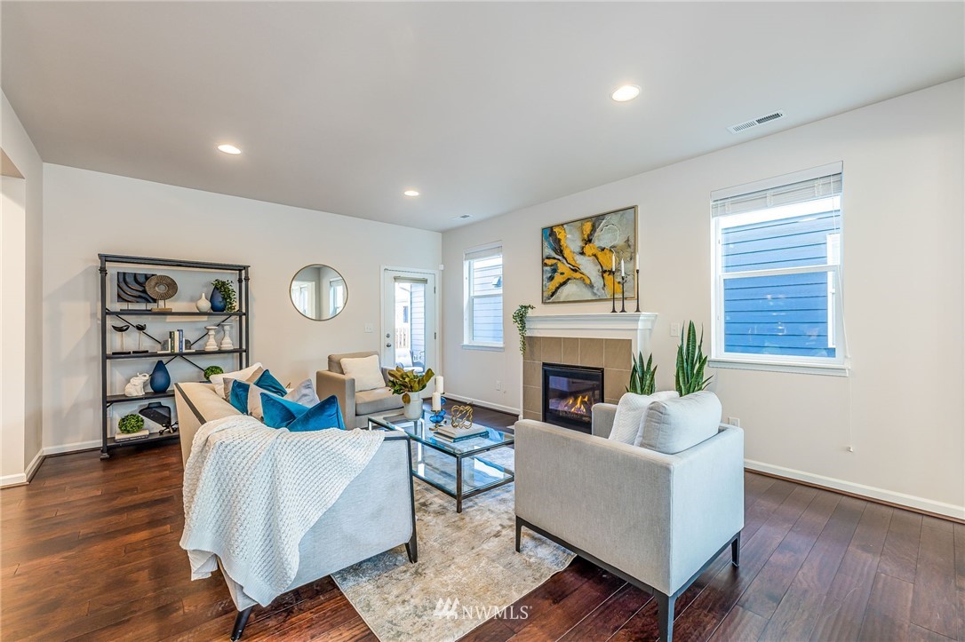 4303 Riverfront Boulevard Everett, WA 98203 - Photo 9 of 40 a living room with furniture a fireplace and a window