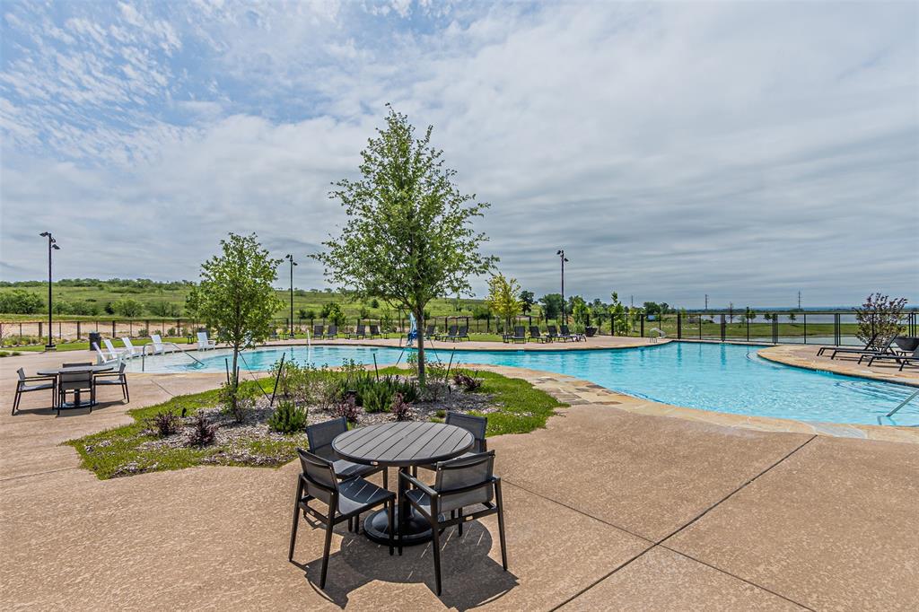 116 Derrett Lane Rhome, TX 76078 - Photo 26 of 30 a view of swimming pool with outdoor seating and plants