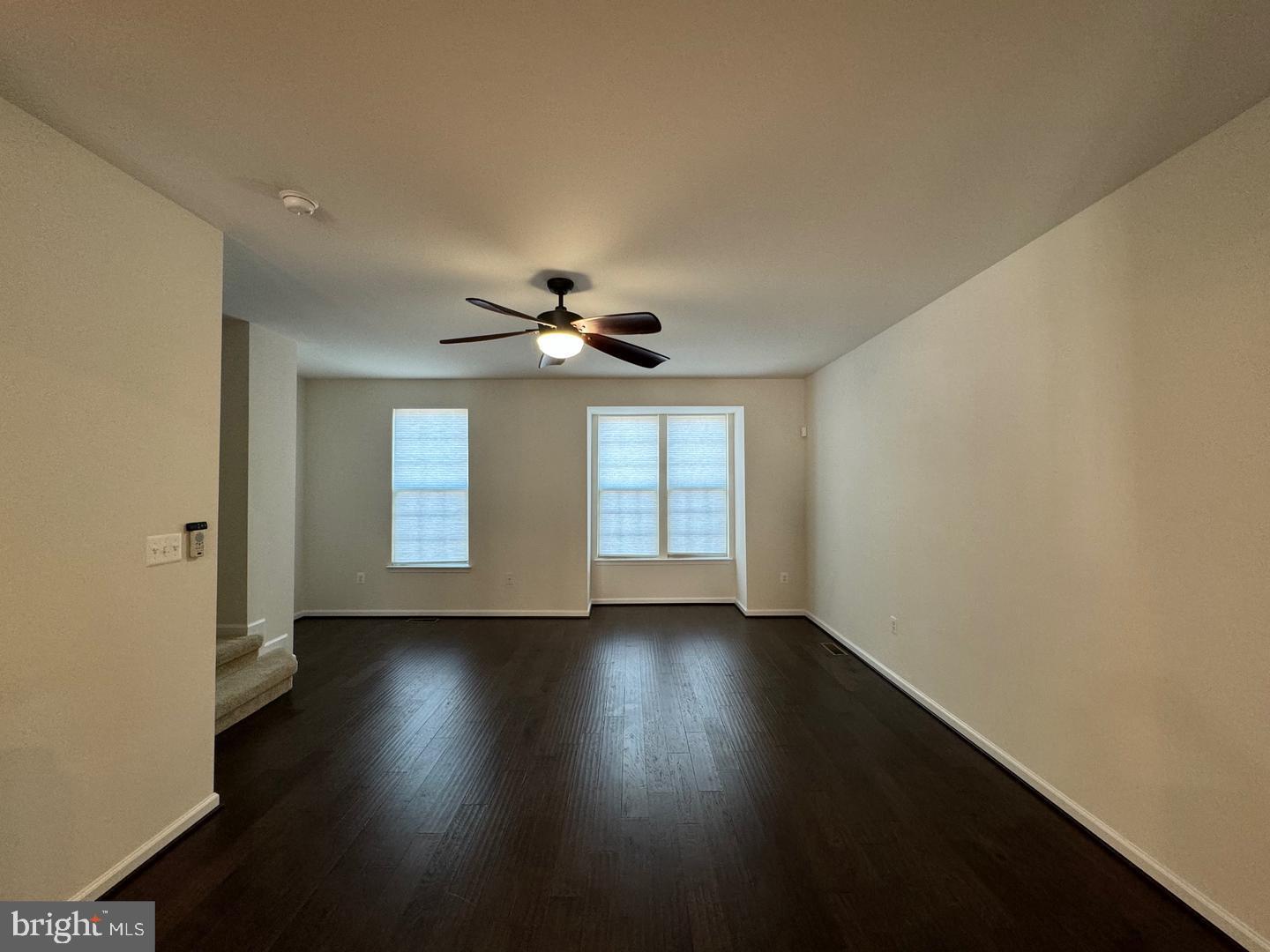 11506 Accord Court Fredericksburg, VA 22408 - Photo 5 of 20 a view of an empty room with wooden floor and a window