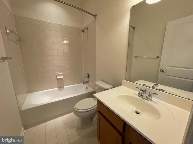 a bathroom with a sink toilet tub and shower