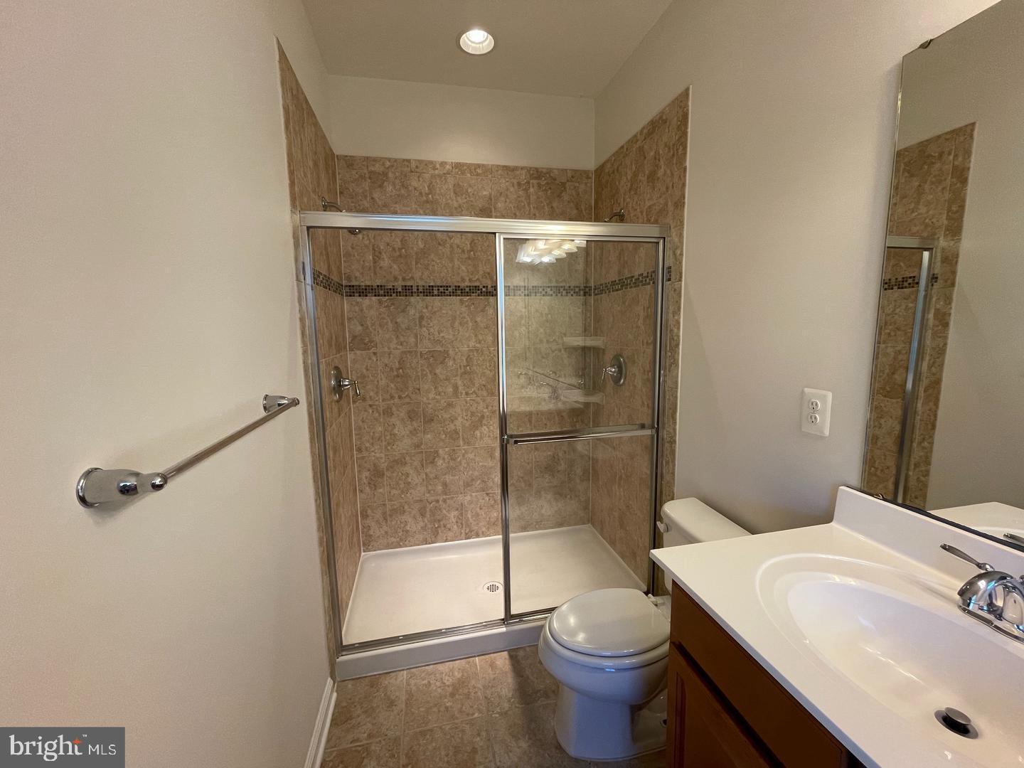11506 Accord Court Fredericksburg, VA 22408 - Photo 10 of 20 a bathroom with a sink toilet and shower