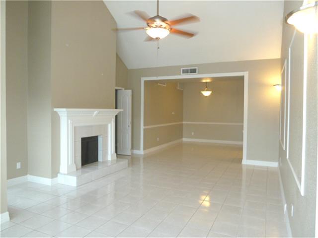 2100 Tanglewilde Street, Unit 8 Houston, TX 77063 - Photo 1 of 20 Large Living Space features cathedral ceiling & Wood Burning Fireplace
