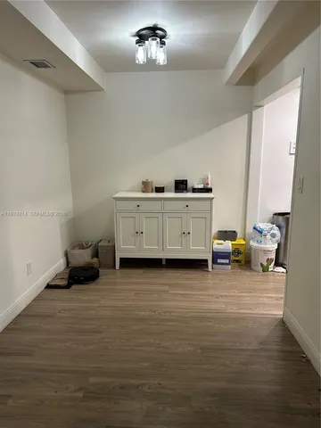 a view of room with furniture and a chandelier