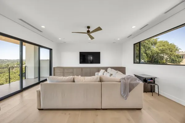 a living room with furniture and a large window
