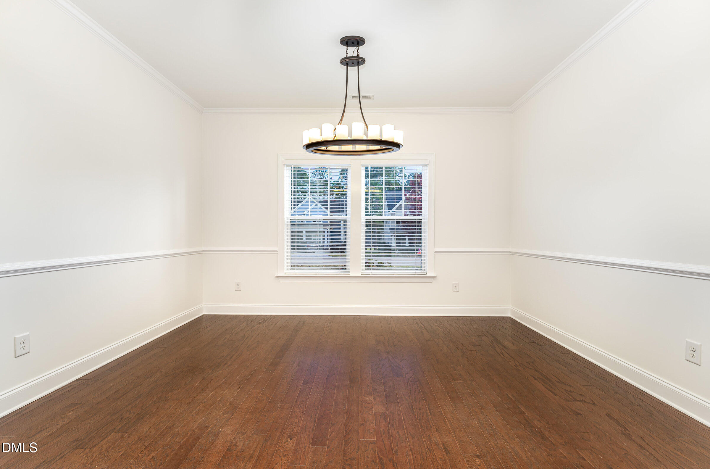 105 Leesville Loop Aberdeen, NC 28315 - Photo 12 of 32 a view of a room with wooden floor a ceiling fan and a window