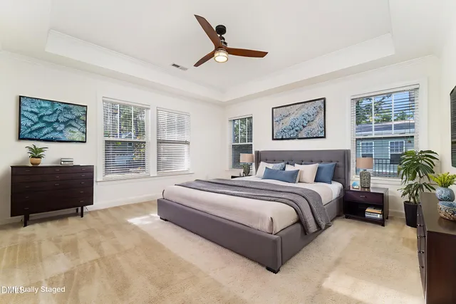 a spacious bedroom with a bed and a couch