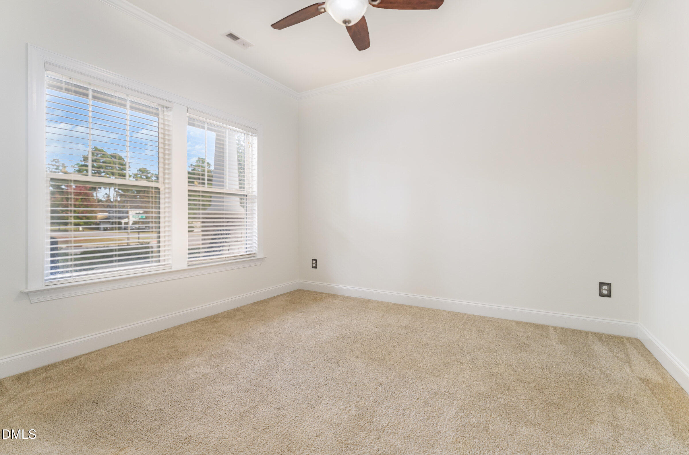 105 Leesville Loop Aberdeen, NC 28315 - Photo 17 of 32 an empty room with ceiling fan and window