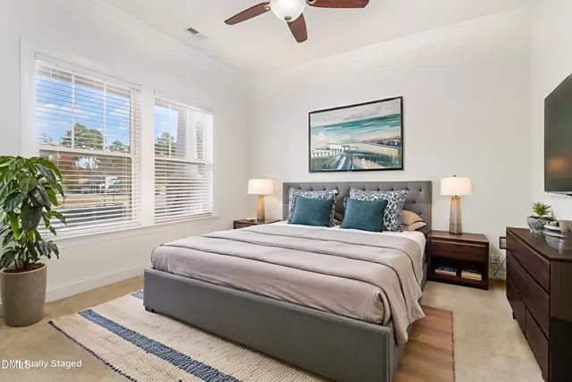 a bedroom with bed and window