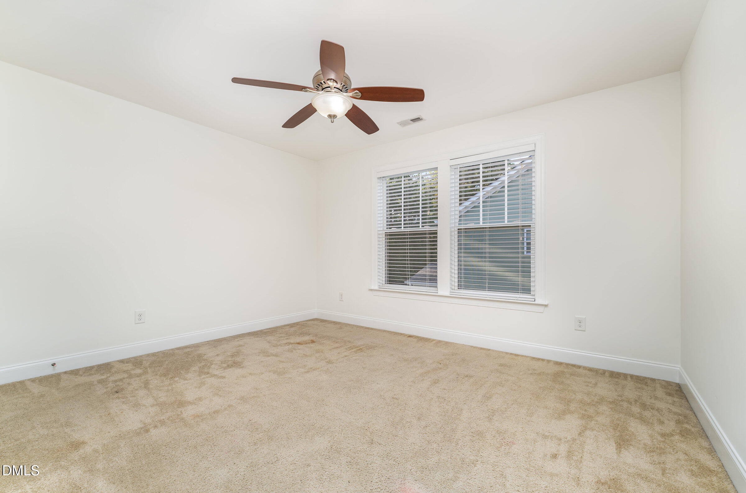 105 Leesville Loop Aberdeen, NC 28315 - Photo 20 of 32 a view of an empty room with a window
