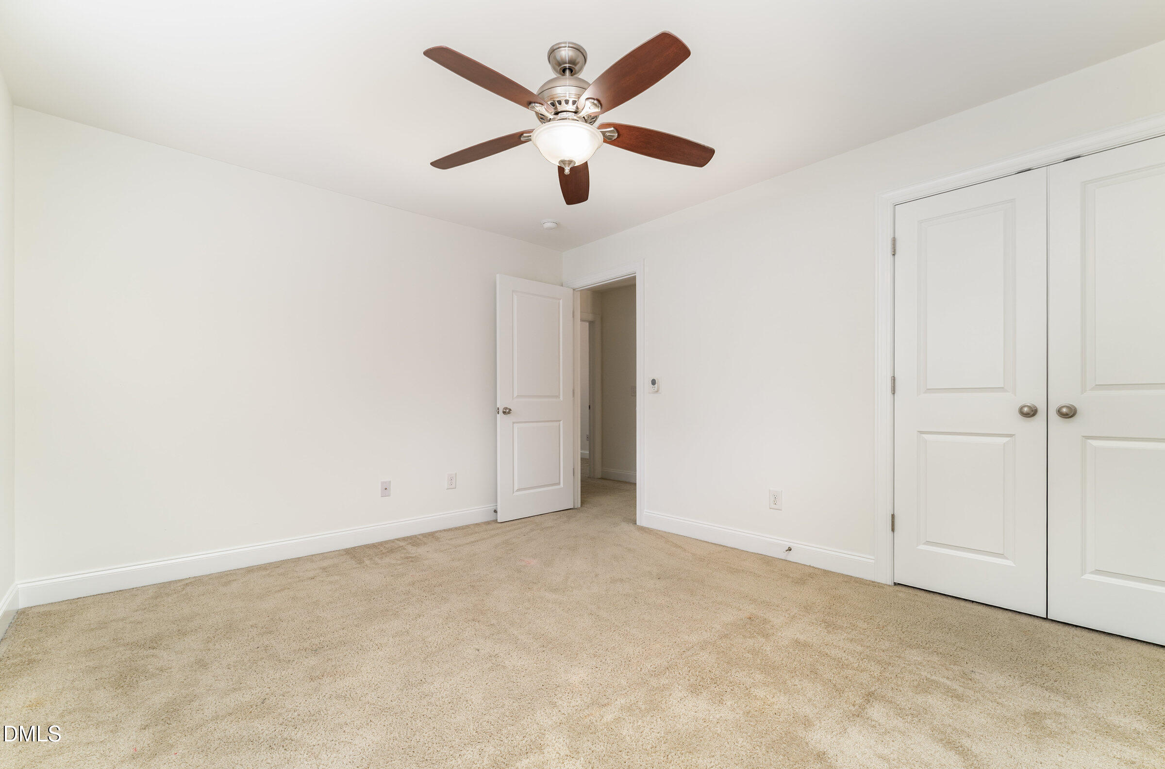 105 Leesville Loop Aberdeen, NC 28315 - Photo 21 of 32 an empty room with closet and a ceiling fan